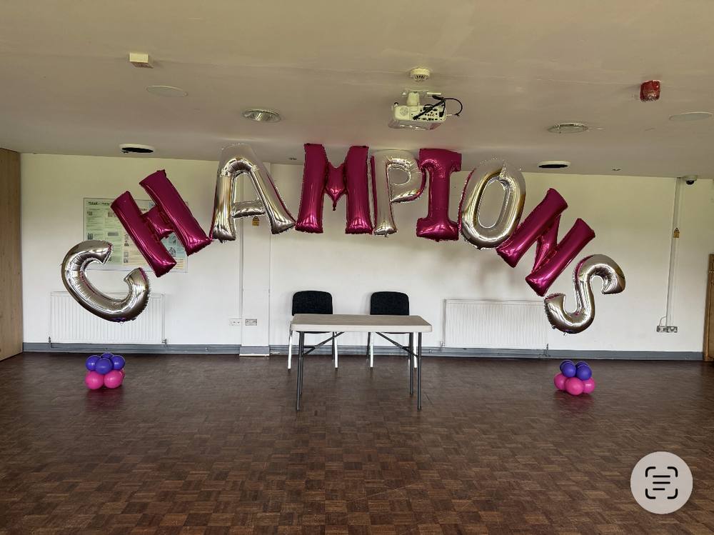Balloon letter garland spelling Champions for a sports celebration