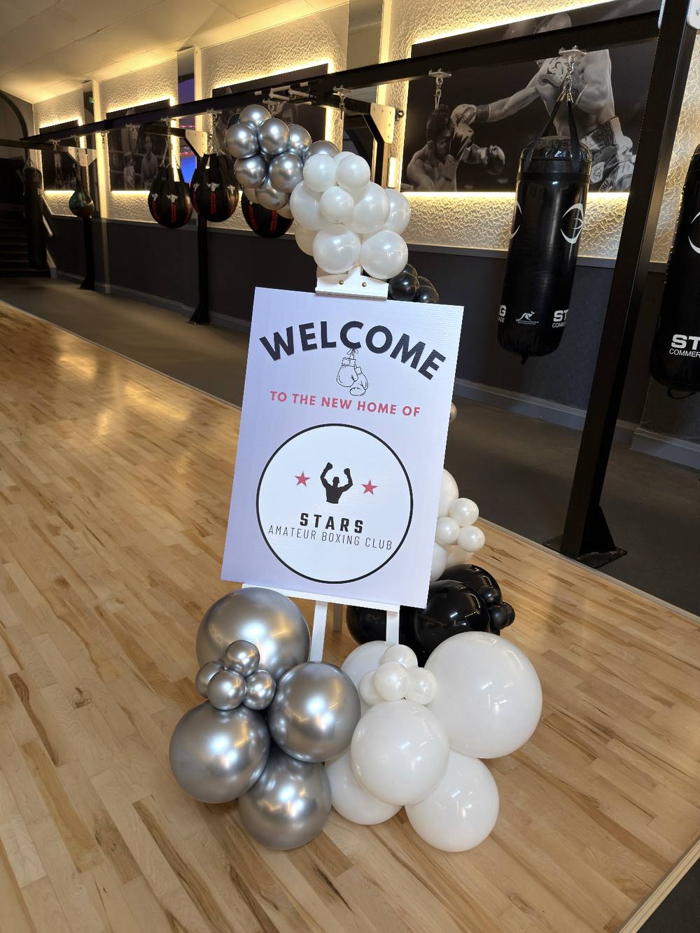 Easel welcome sign with balloon display for a boxing club launch