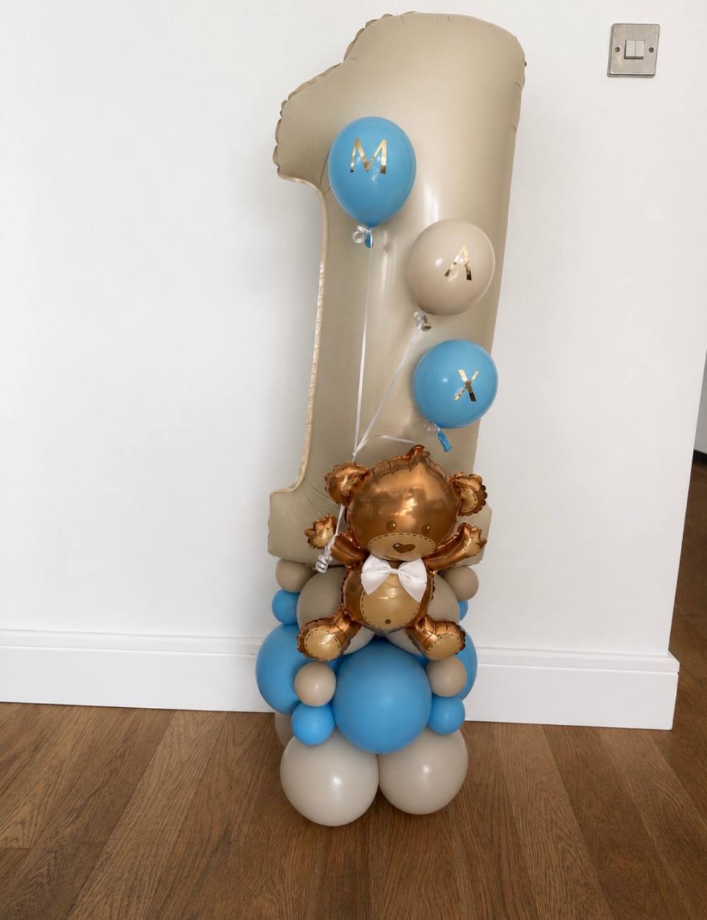 Number one balloon stack with teddy bear topper for a first birthday