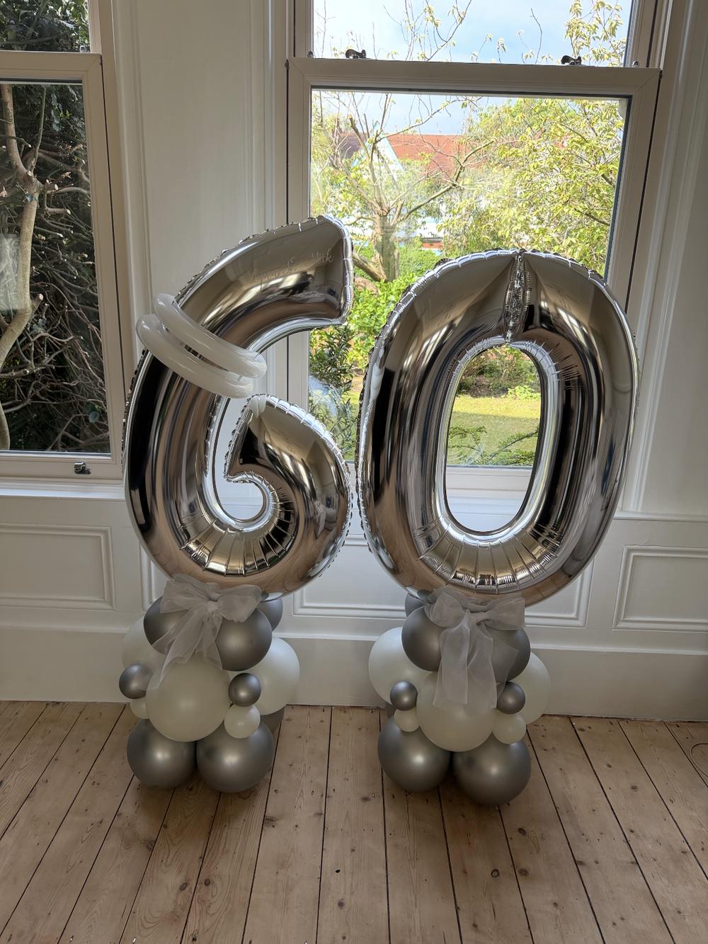 Silver 60th birthday number balloon stacks